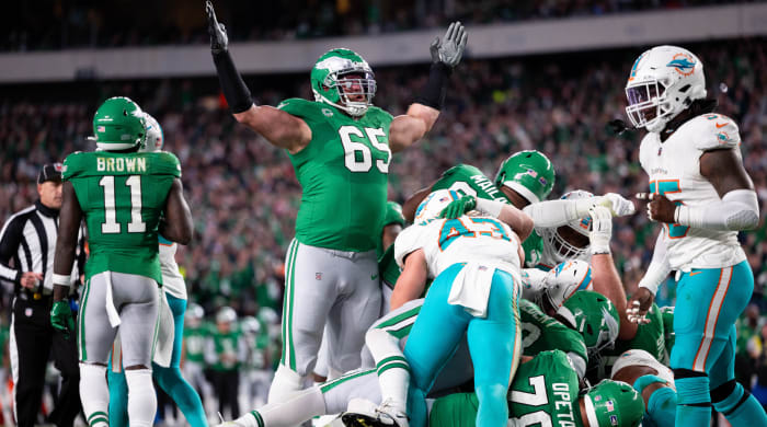 Eagles offensive tackle Lane Johnson celebrates after a Jalen Hurts touchdown on a quarterback sneak, or Tush Push, against the Dolphins.